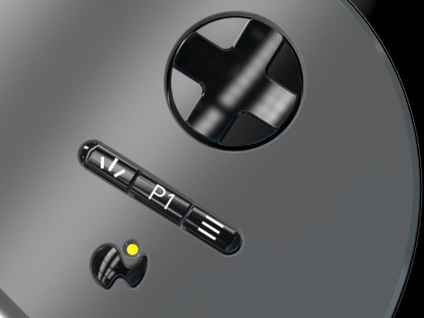 Nahaufnahme der Tasten eines Gamepad-Controllers: ein Steuerkreuz, eine P1-Taste und ein Modusschalter.