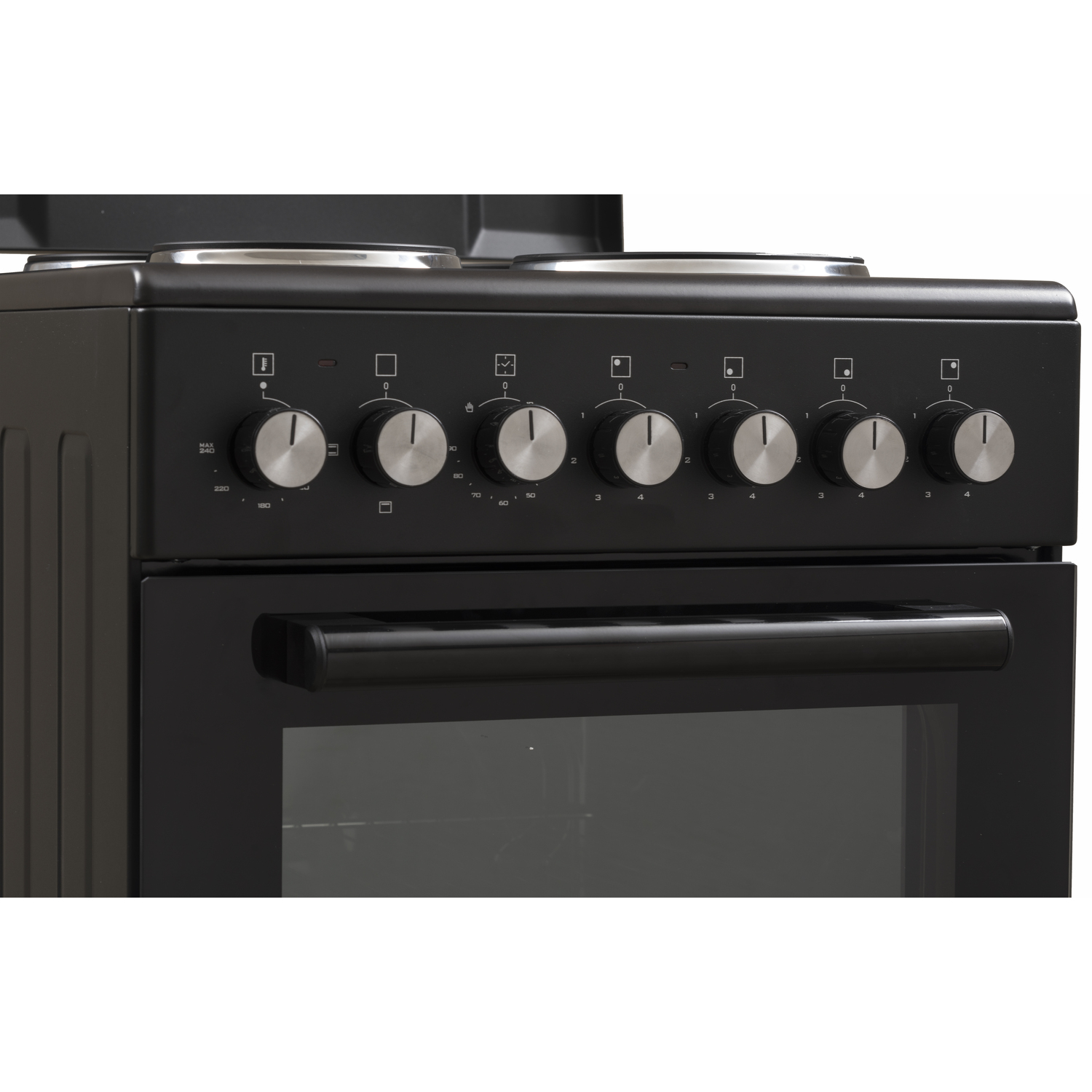 A close-up of a black stove top with six silver control knobs and oven.