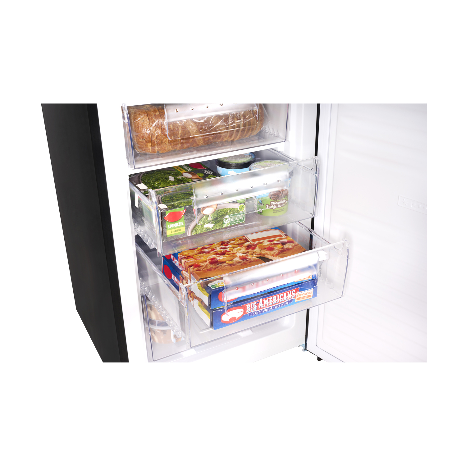 Interior of a refrigerator with shelves and drawers. Food items are stored inside the drawers.