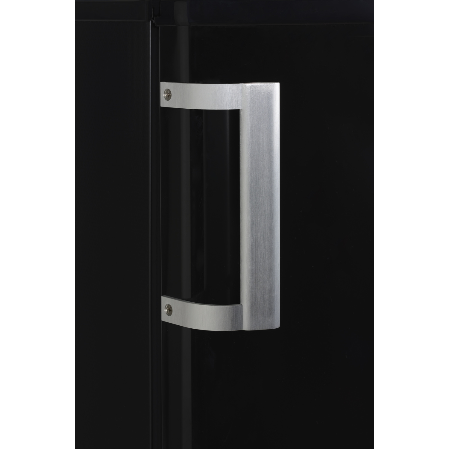 A close-up of a silver handle on a black cabinet door. The handle is rectangular.