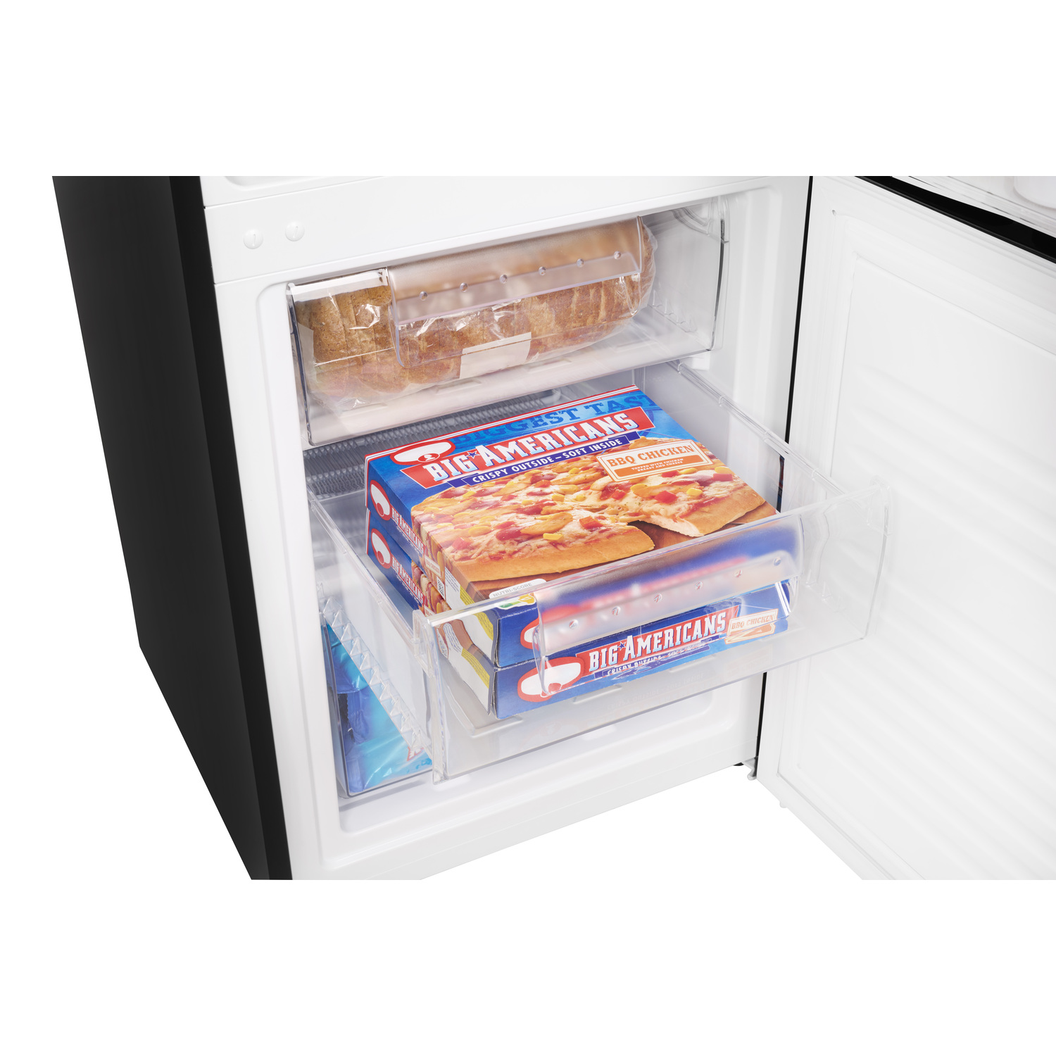 Freezer with drawers containing frozen pizza and other items.