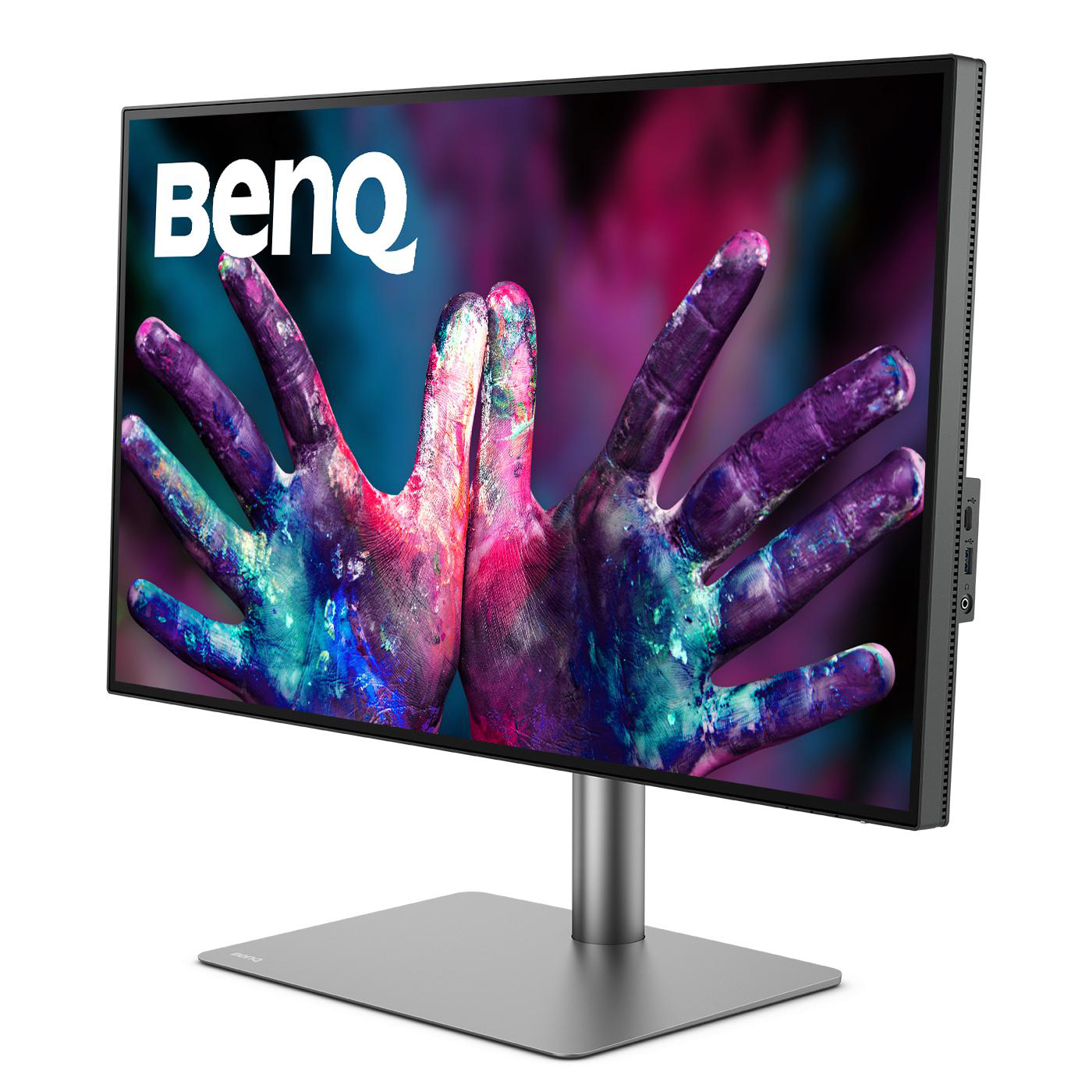 Ein BenQ-Monitor zeigt ein farbenfrohes Bild mit bemalten Händen.