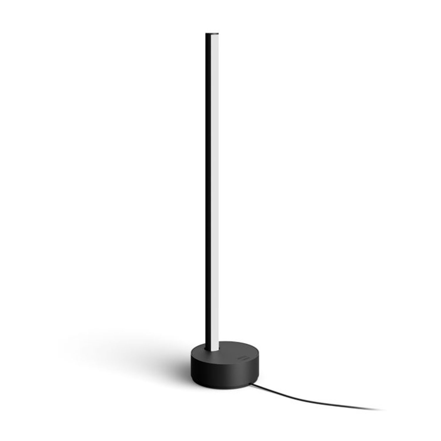 Una lampada alta in bianco e nero su sfondo bianco, base nera, luce bianca.