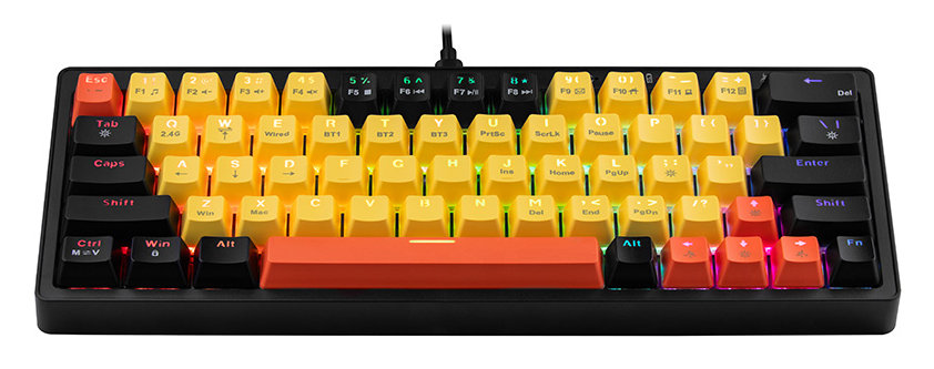 Czarna klawiatura mechaniczna z kolorowymi nakładkami w gradientowym wzorze. Klawiatura leży na biurku.