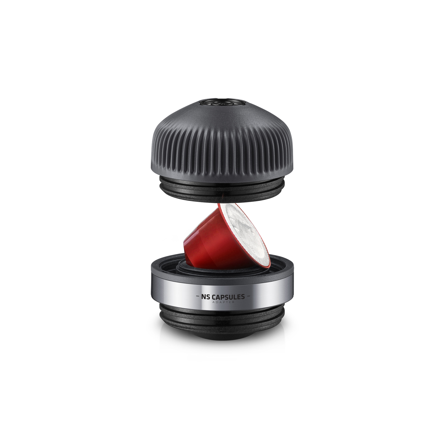 Black and silver coffee capsule holder with a red coffee capsule being placed into it.