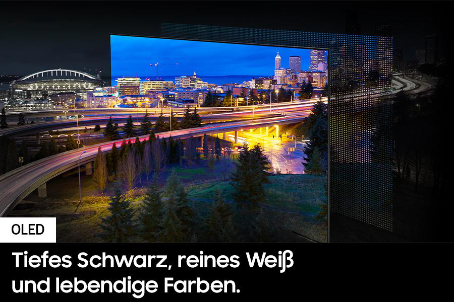 OLED-Fernseher, der eine Skyline bei Nacht zeigt. Text auf Deutsch unten.