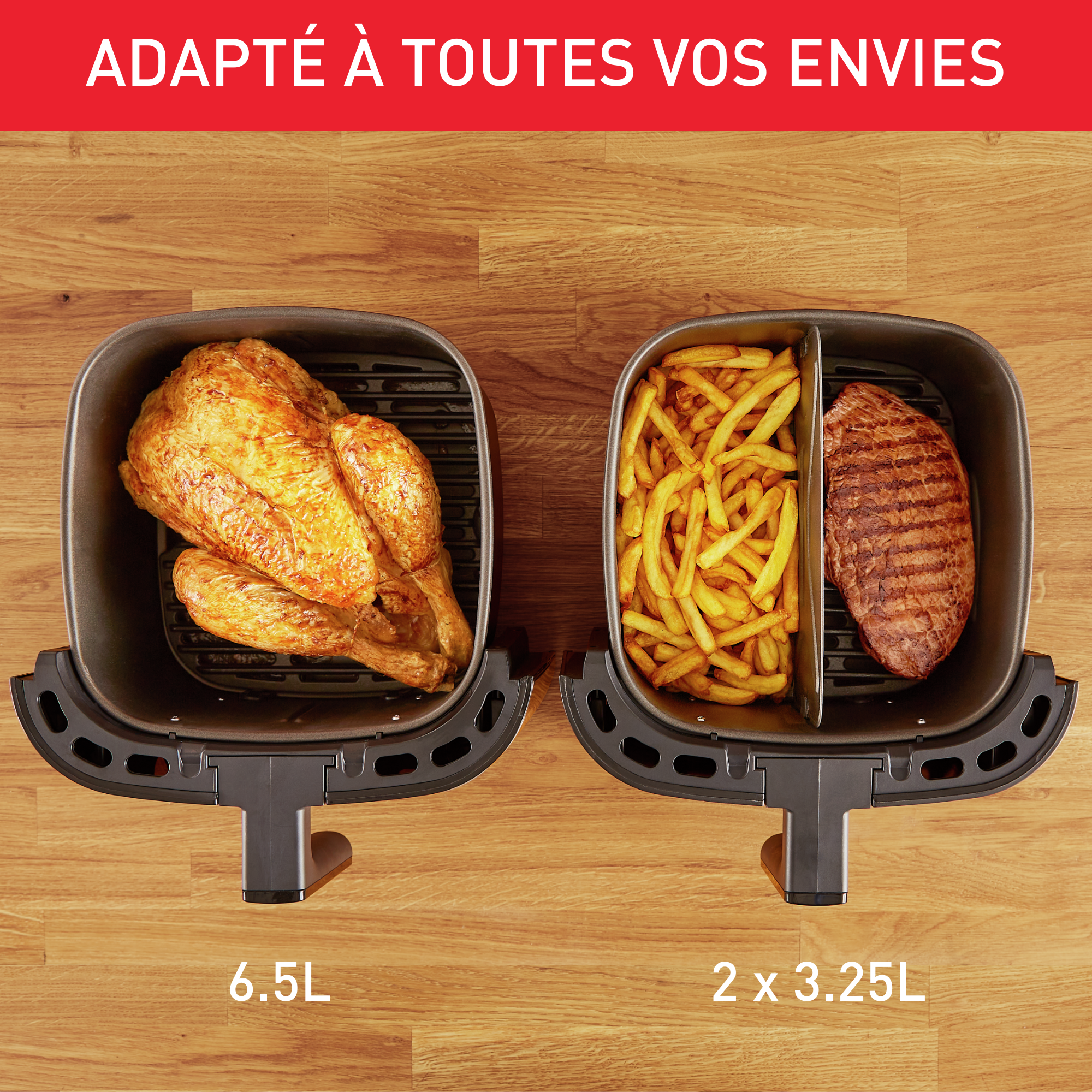 Une friteuse à air avec poulet, frites et steak dans des compartiments séparés, sur une surface en bois.