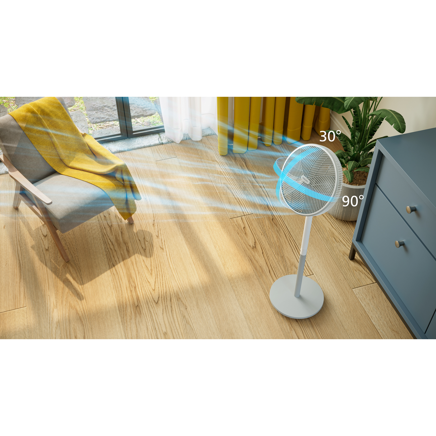A white fan blowing air across a wooden floor with a chair and cabinet.