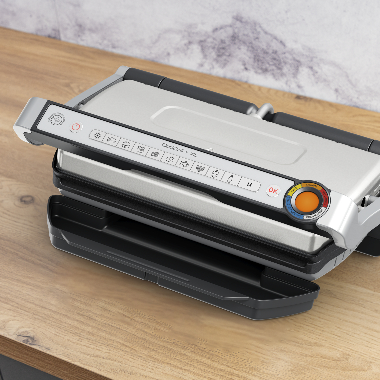 Grill with control panel. Wood table background.