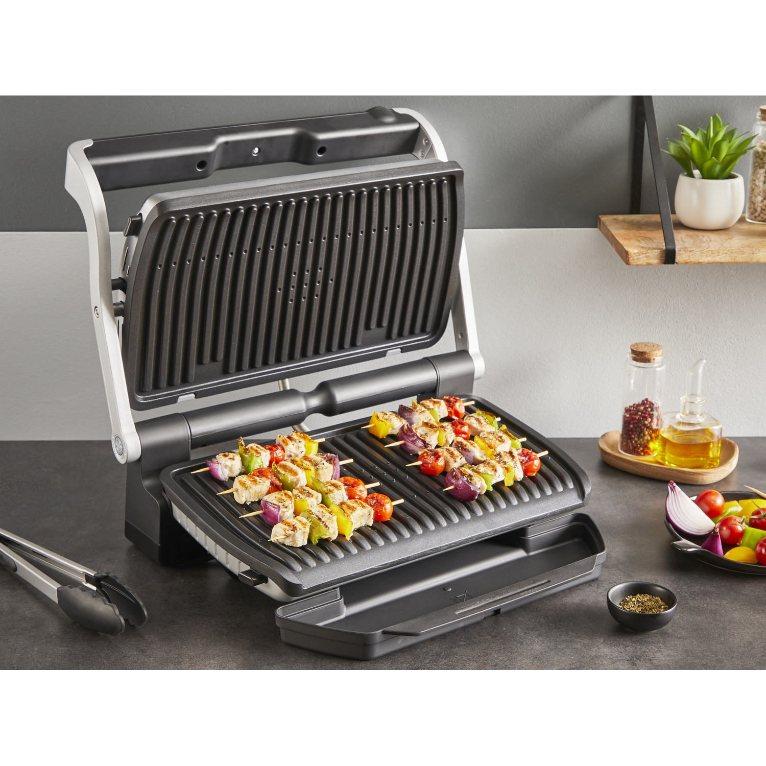 Grill with skewers of meat and vegetables.