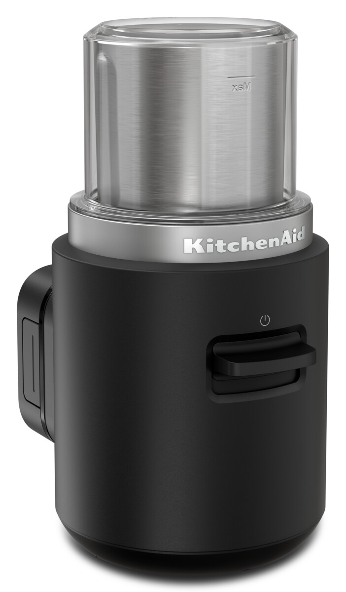 Schwarzer KitchenAid-Zerkleinerer mit durchsichtigem Deckel und silbernem Band.