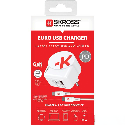 Fehér és piros doboz USB töltővel és kábelekkel.