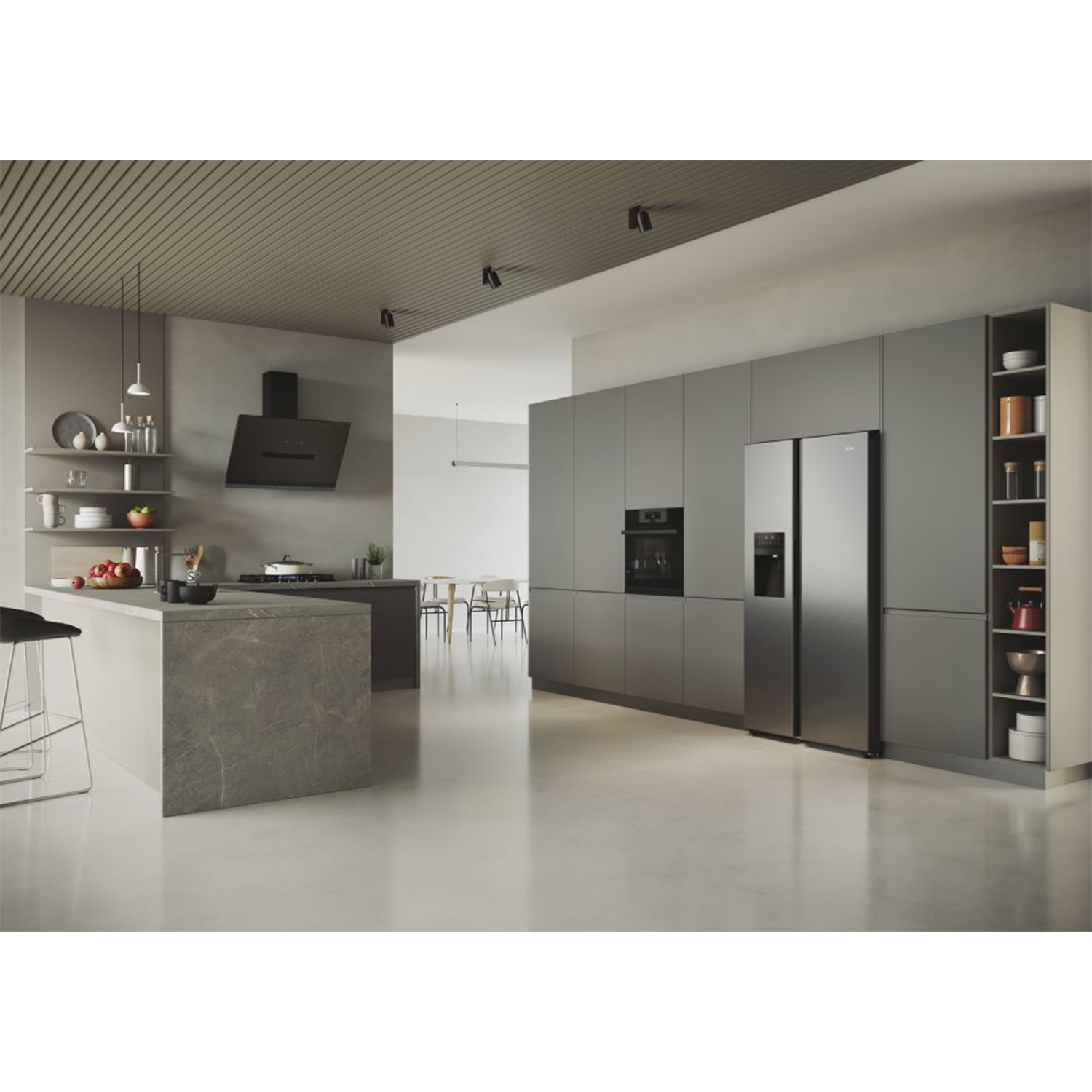 Cucina moderna con mobili grigi, isola e elettrodomestici. Sgabello davanti all'isola.