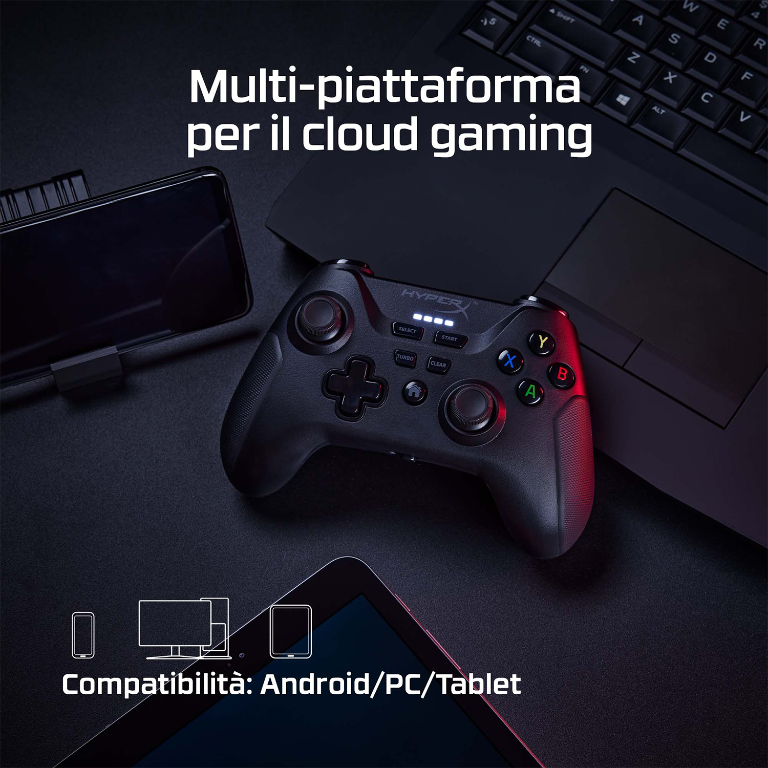 Un controller di gioco nero con un telefono e un tablet, su una superficie nera.