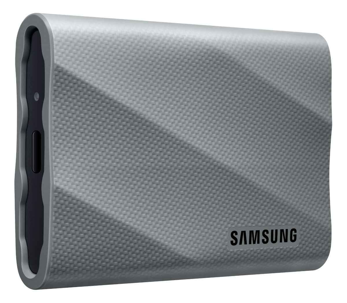 Srebrny przenośny dysk SSD Samsung. Prostokątny kształt, teksturowana powierzchnia. Czarne akcenty i port.