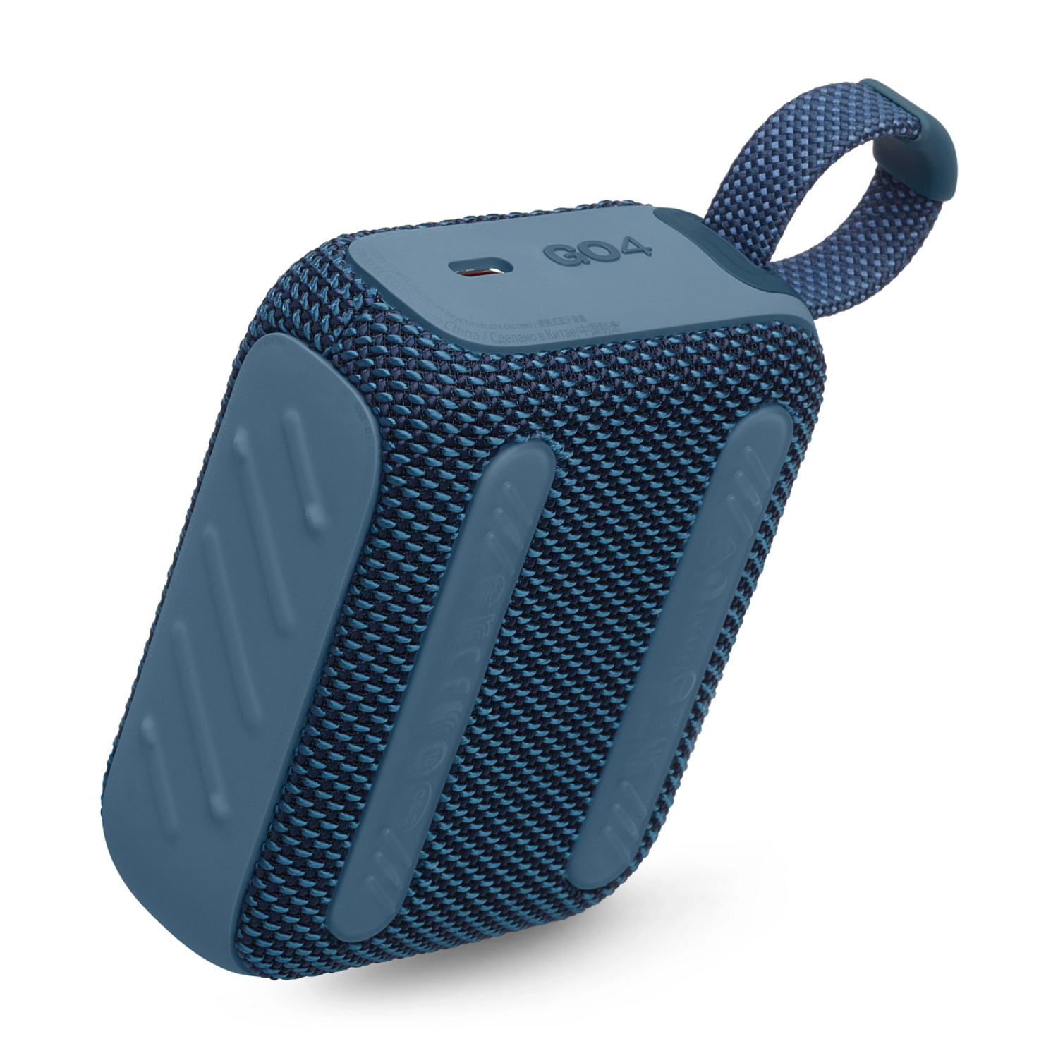 Blue and black JBL Go 4 speaker on white surface. The speaker has a fabric-like texture.