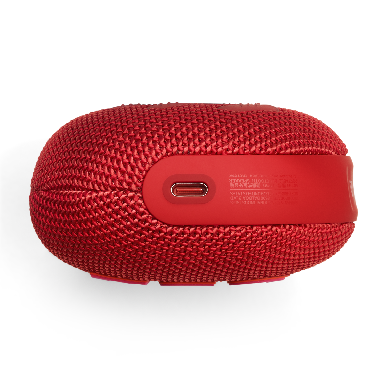 Red, cylindrical speaker with a USB port. It's on white background.