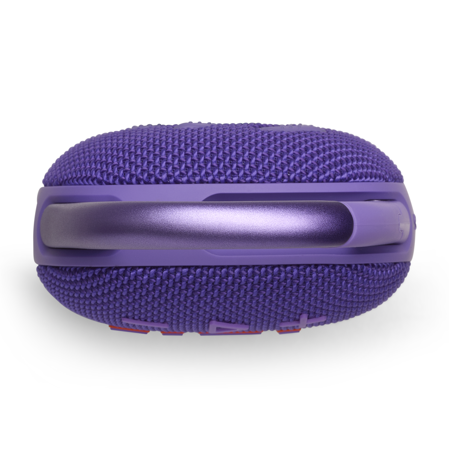A purple speaker with a handle and a mesh exterior. The speaker sits on a white surface.