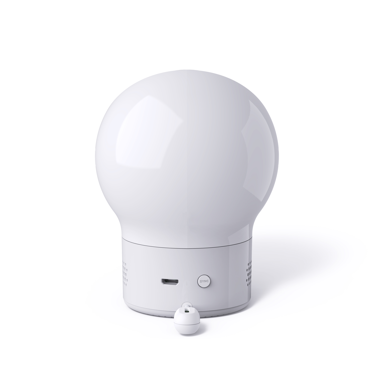 Een witte, afgeronde lamp met een bolvormige bovenkant en een cilindrische voet. Een kleine afstandsbediening.