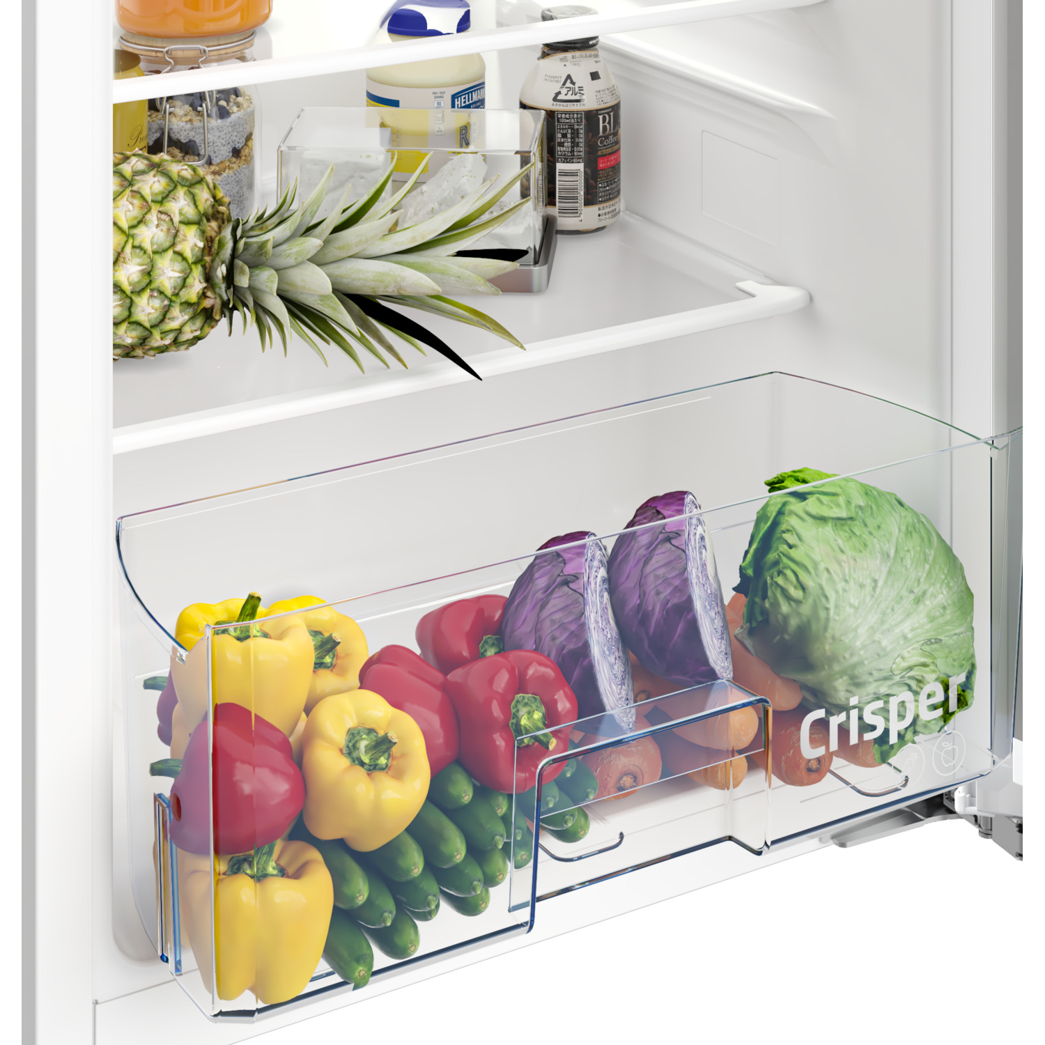 Refrigerator drawer filled with colorful vegetables: peppers, cucumbers, cabbage, carrots.