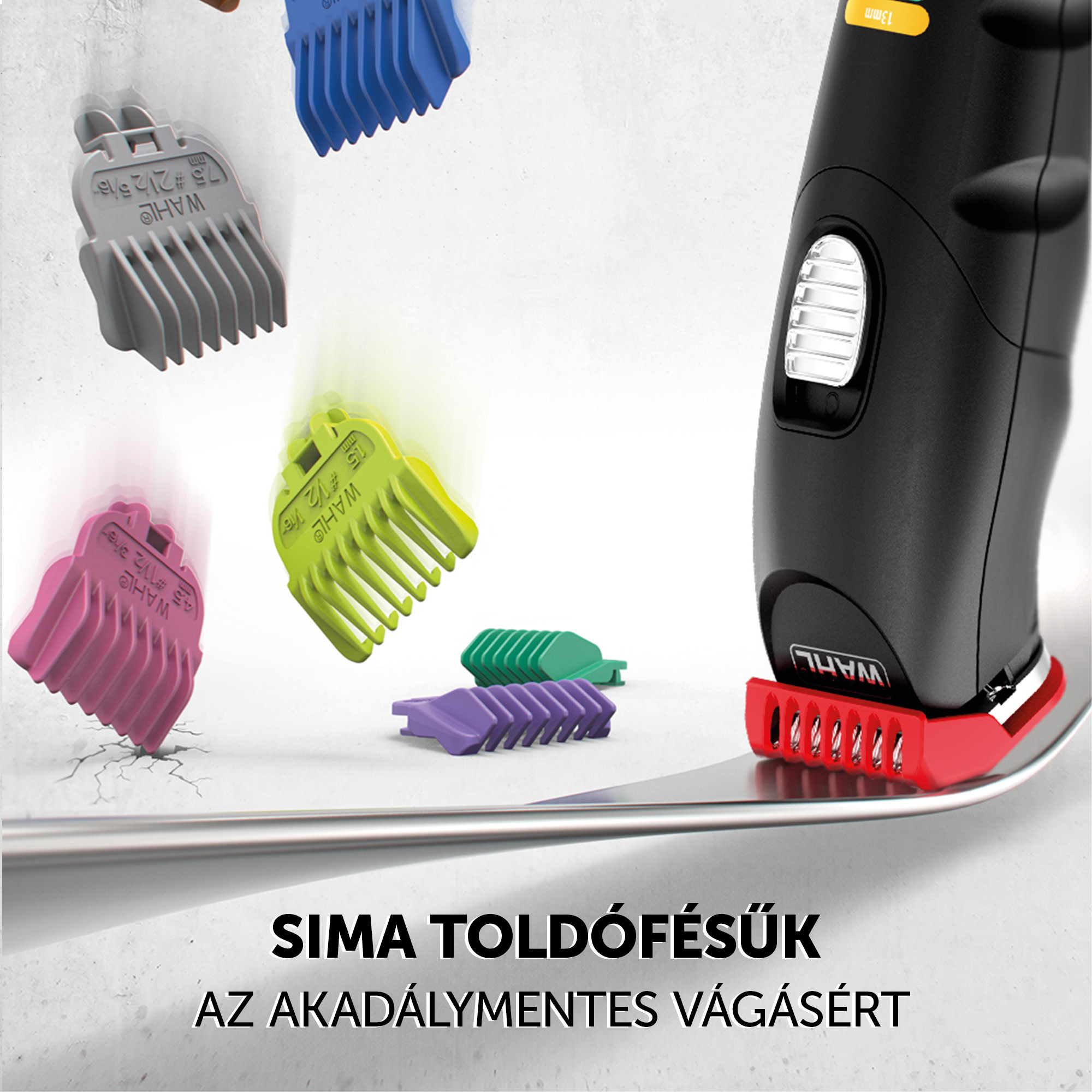 Hajvágó gép különböző színű tartozékokkal és pengékkel, egy felületre helyezve.