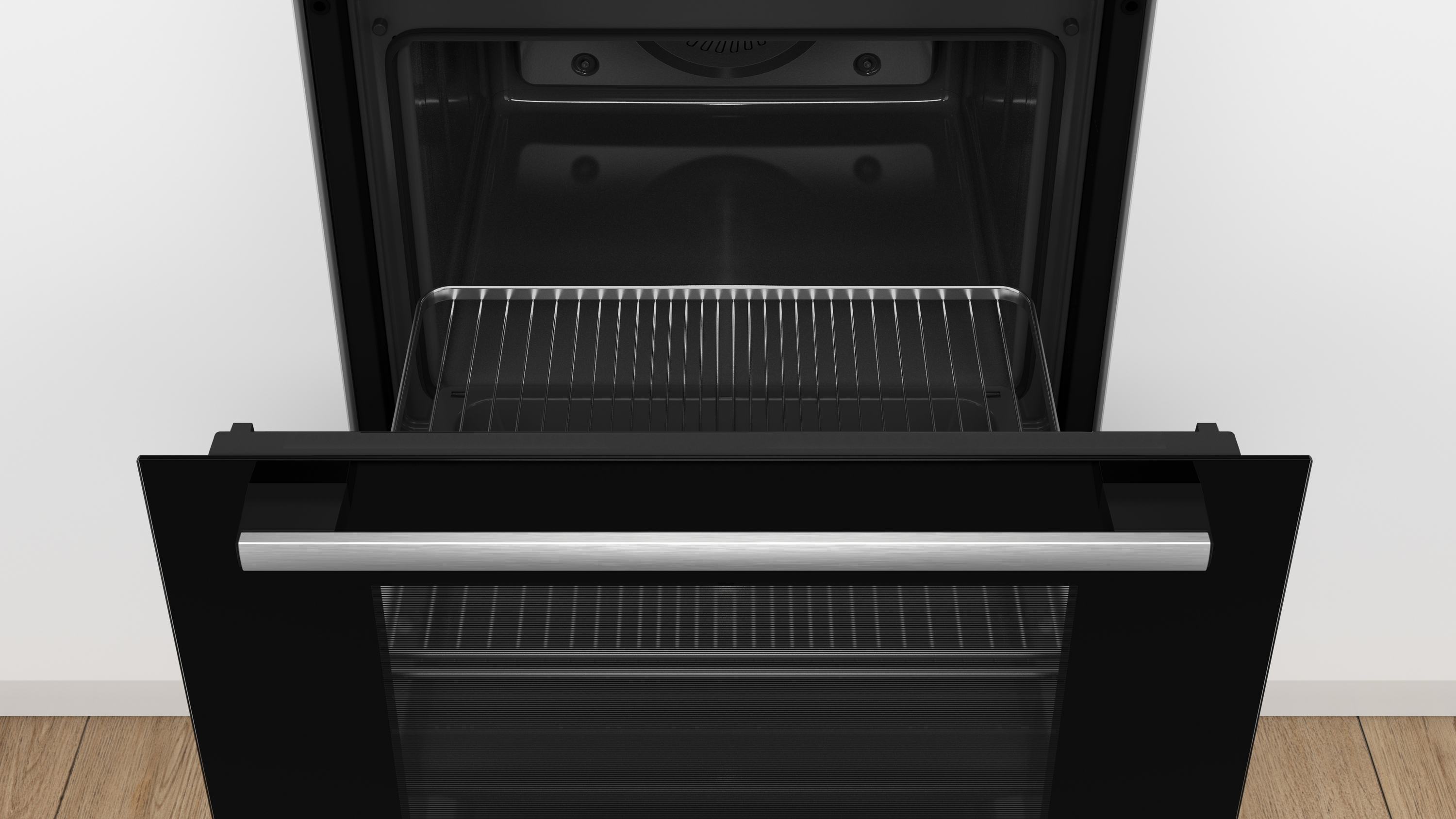 Four ouvert avec une grille métallique à l'intérieur, intérieur noir.