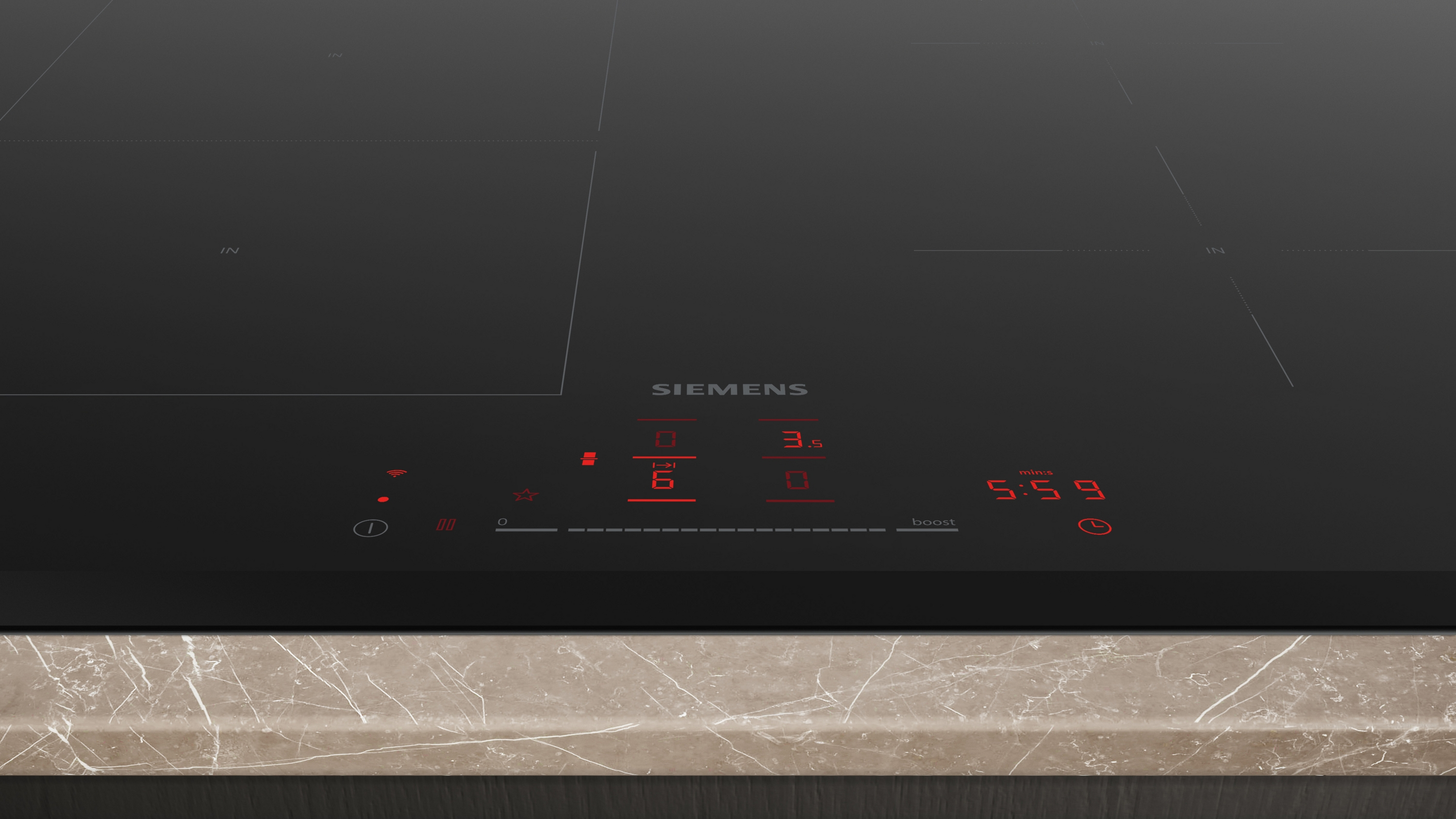 Black induction cooktop with red digital display and Siemens logo. Controls are visible.