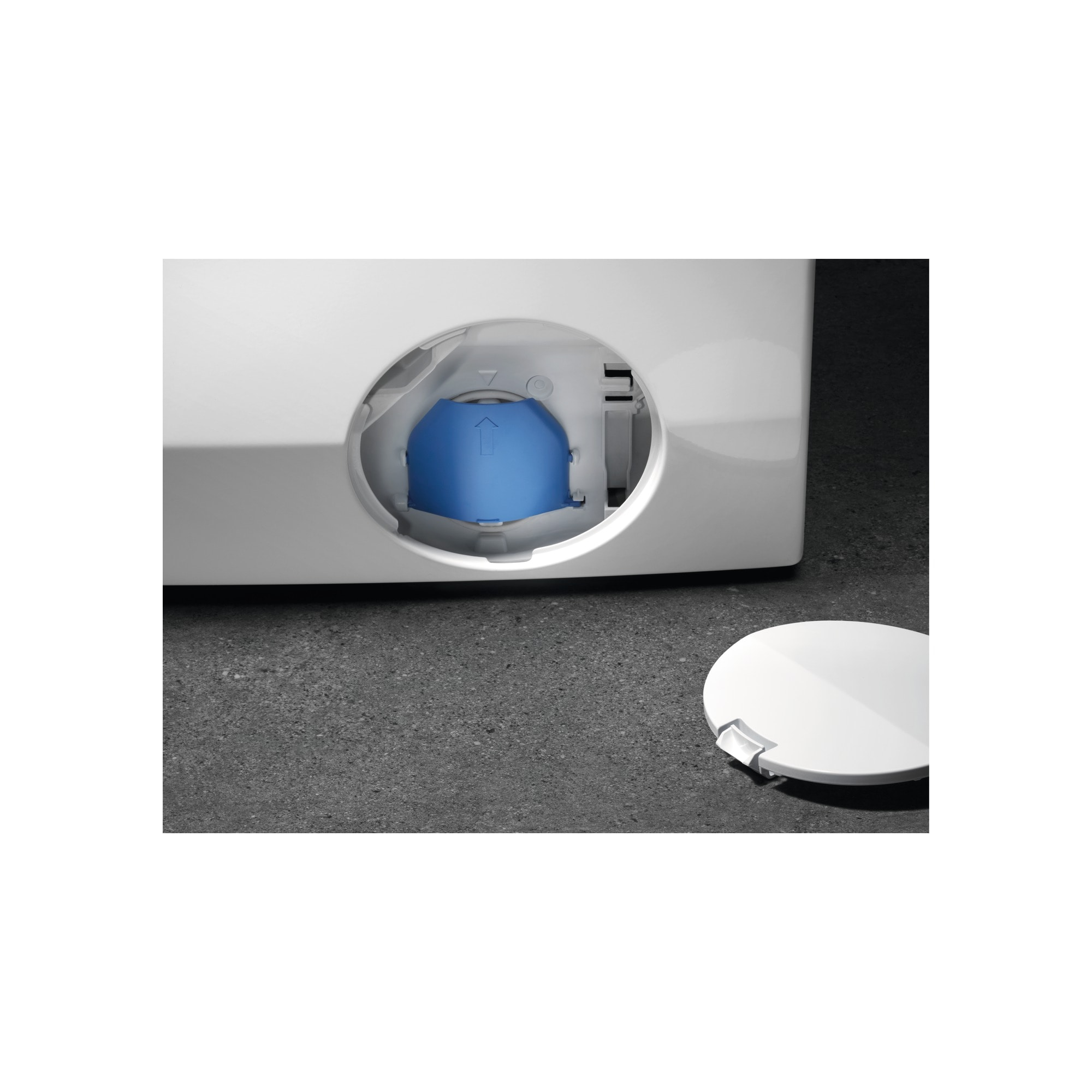 A blue valve on a white washing machine.