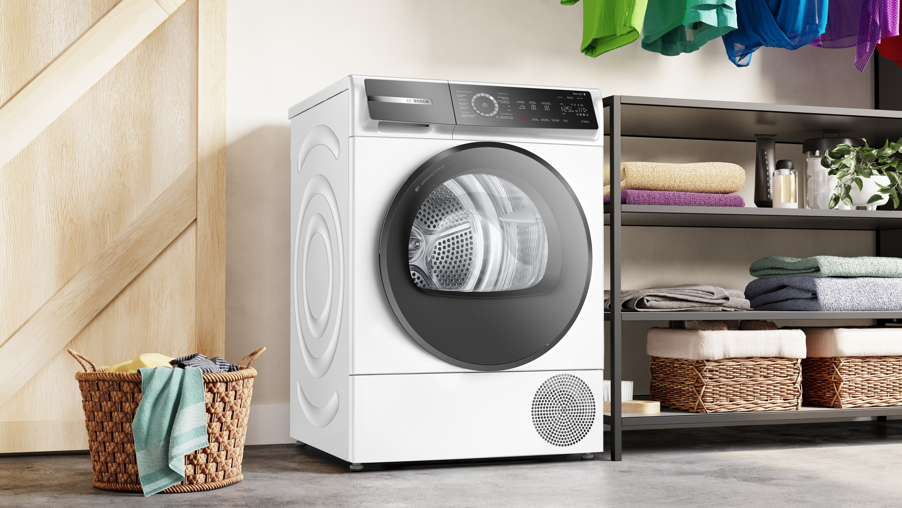 Un sèche-linge blanc avec porte et panneau de contrôle noirs. Un panier est devant.