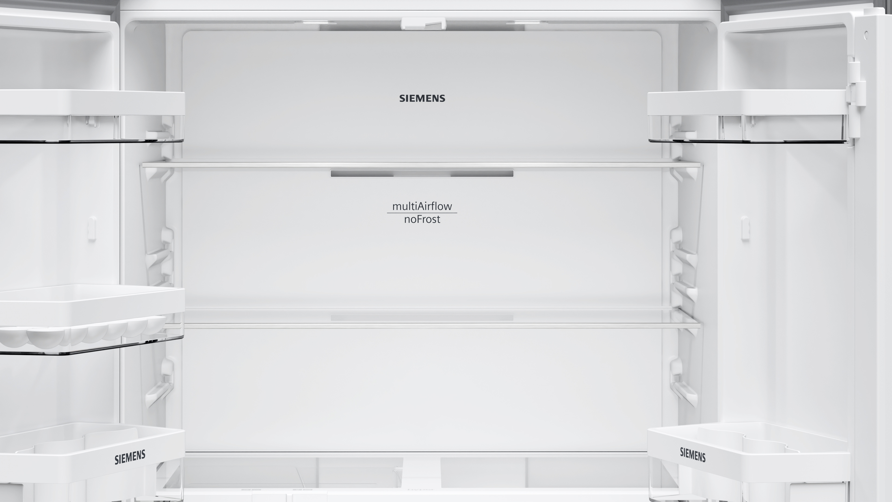 Innenraum eines Kühlschranks, leer mit Regalen und Siemens-Logo.