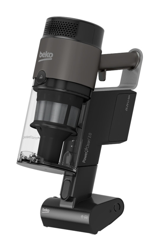 Szaro-czarny odkurzacz bezprzewodowy, pod kątem, z przezroczystym pojemnikiem na kurz, na białym tle.