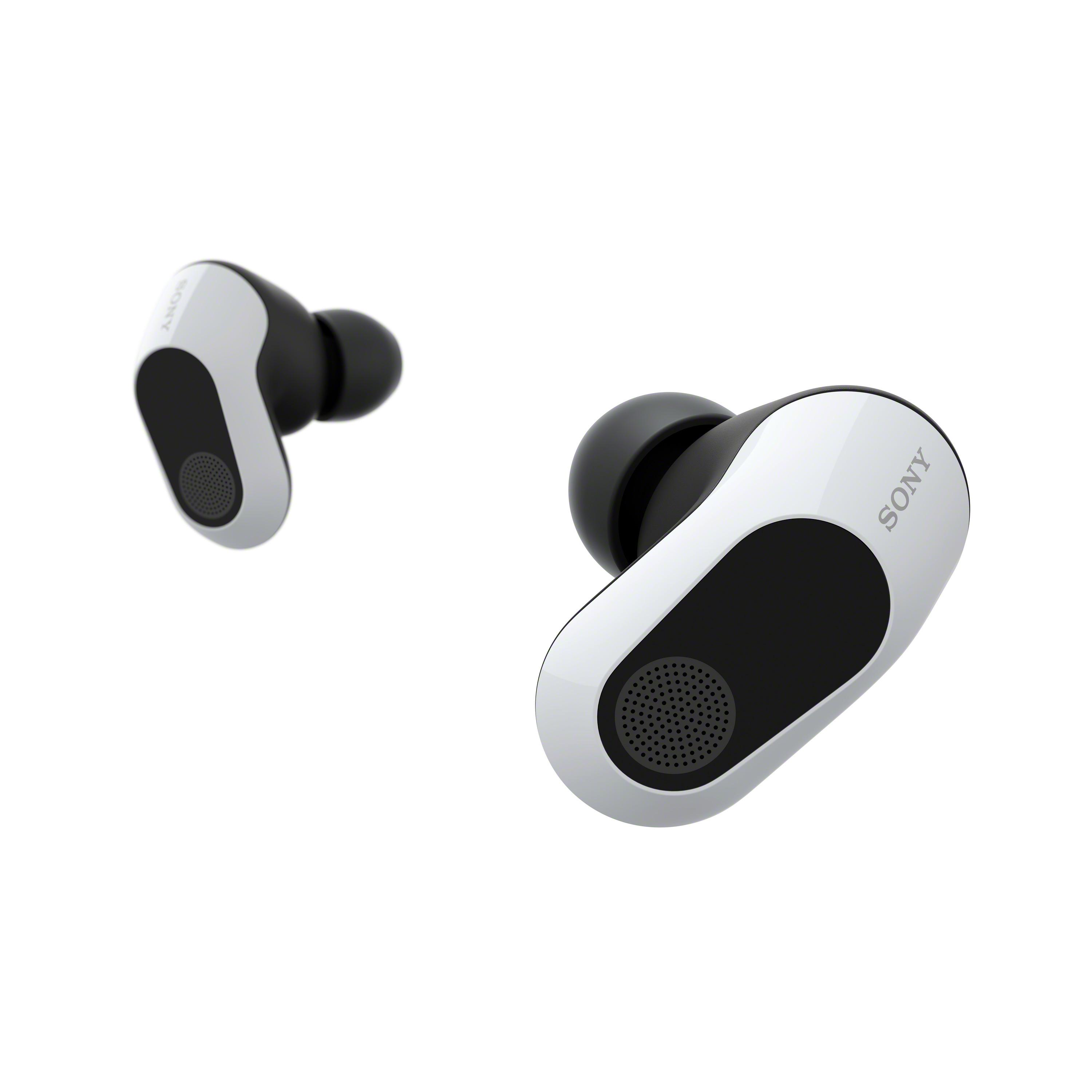 Dos auriculares blancos y negros se muestran sobre un fondo blanco, inclinados hacia el espectador.