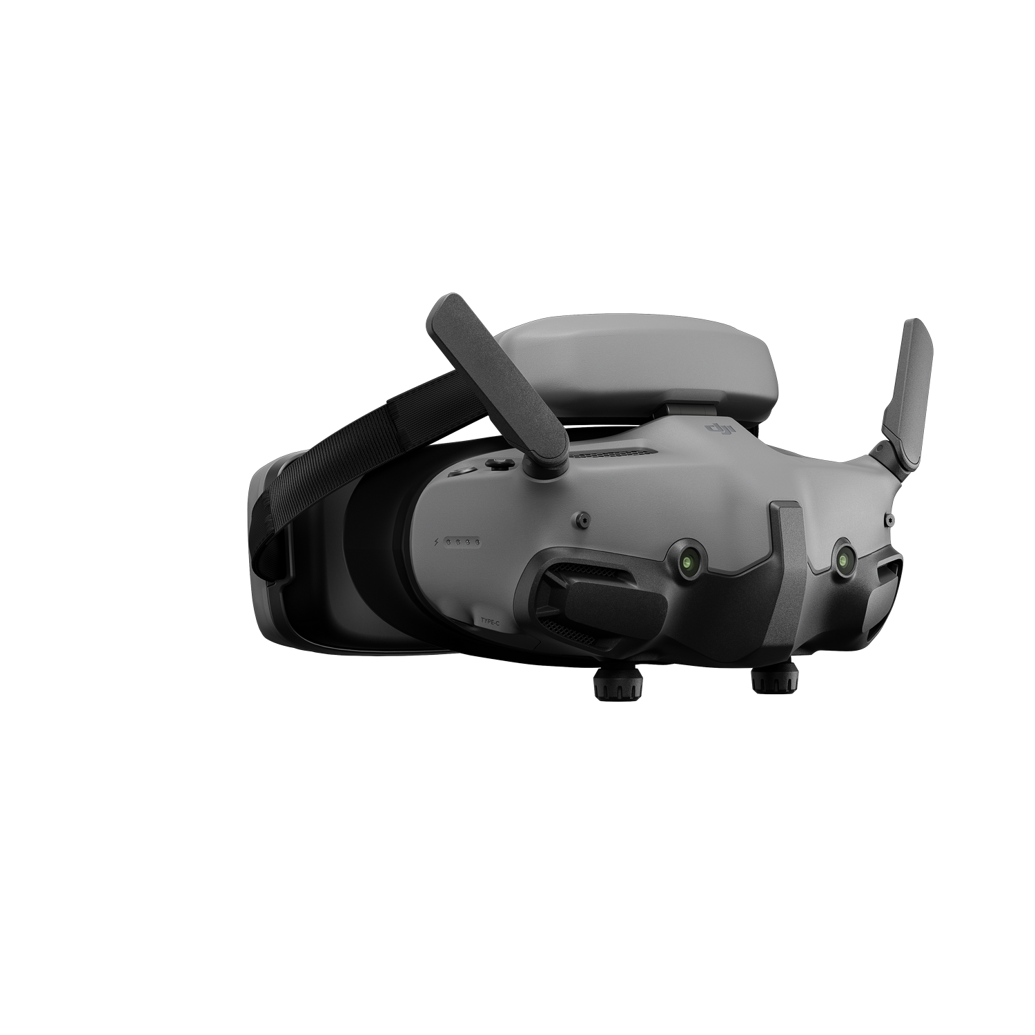 Un casco de realidad virtual gris con antenas, vista lateral, aislado sobre fondo negro.