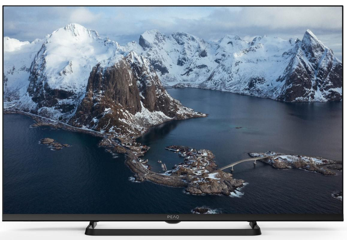 Ein Fernseher, der eine schneebedeckte Berglandschaft zeigt, und ein schwarzer Ständer.