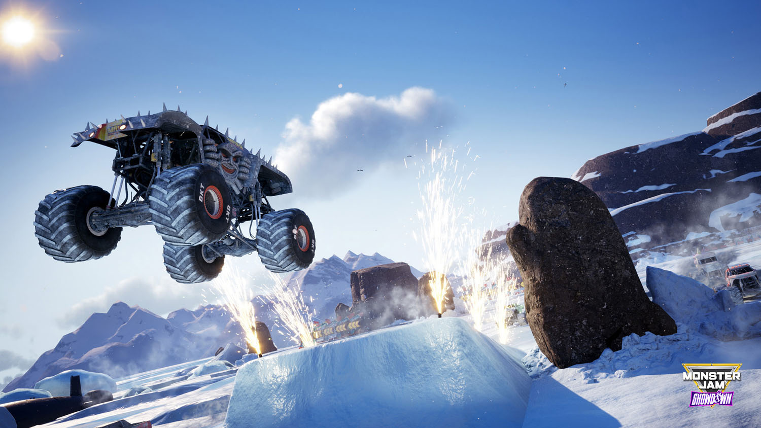 Monster truck sautant par-dessus la glace avec des étincelles et un autre camion en arrière-plan.