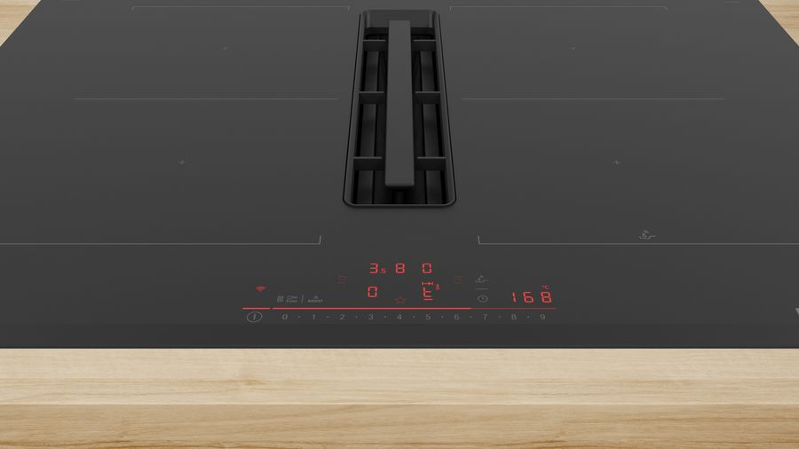 Una encimera negra con una pantalla digital que muestra números. La pantalla tiene controles táctiles. El fondo es de madera.