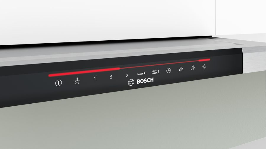 Panel de control negro con luces rojas y el logotipo de Bosch, en una superficie gris clara.