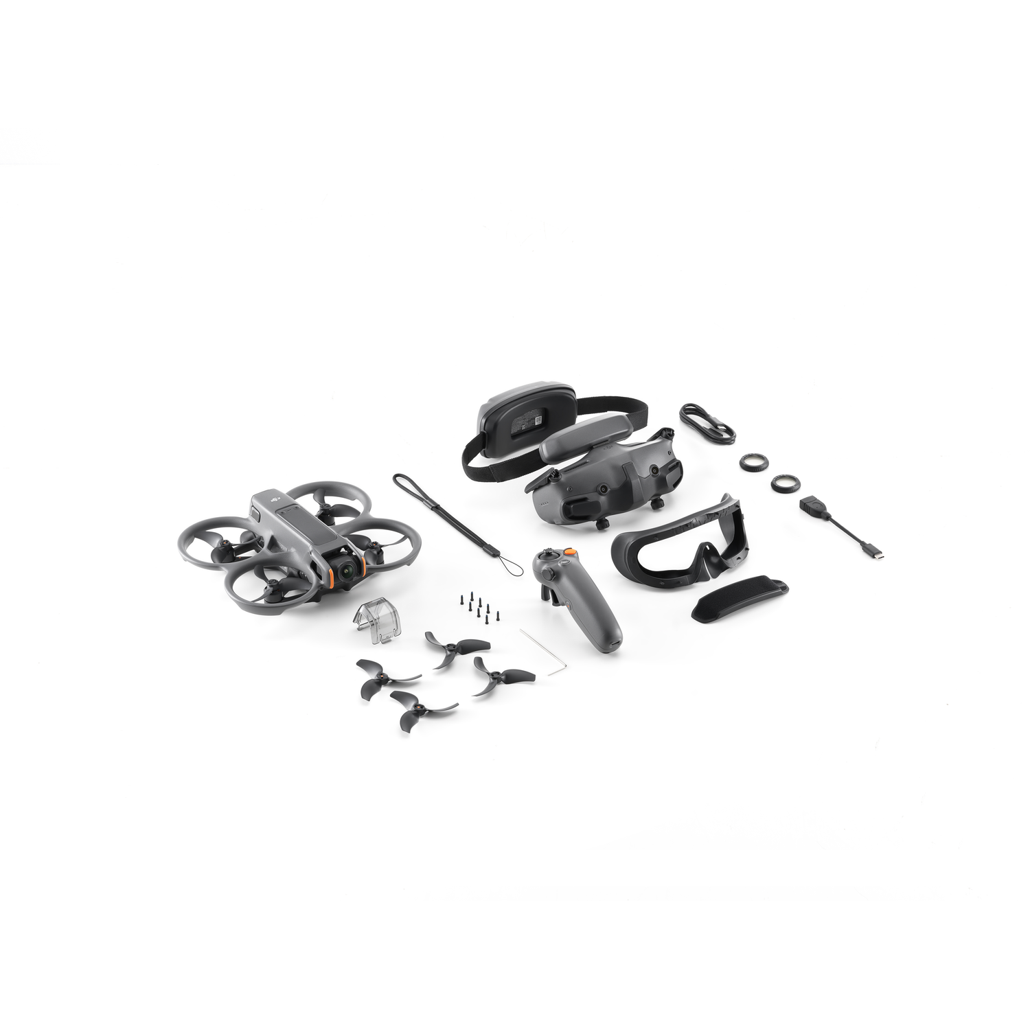 Drone and accessories laid out on a white background. Black and gray colors.