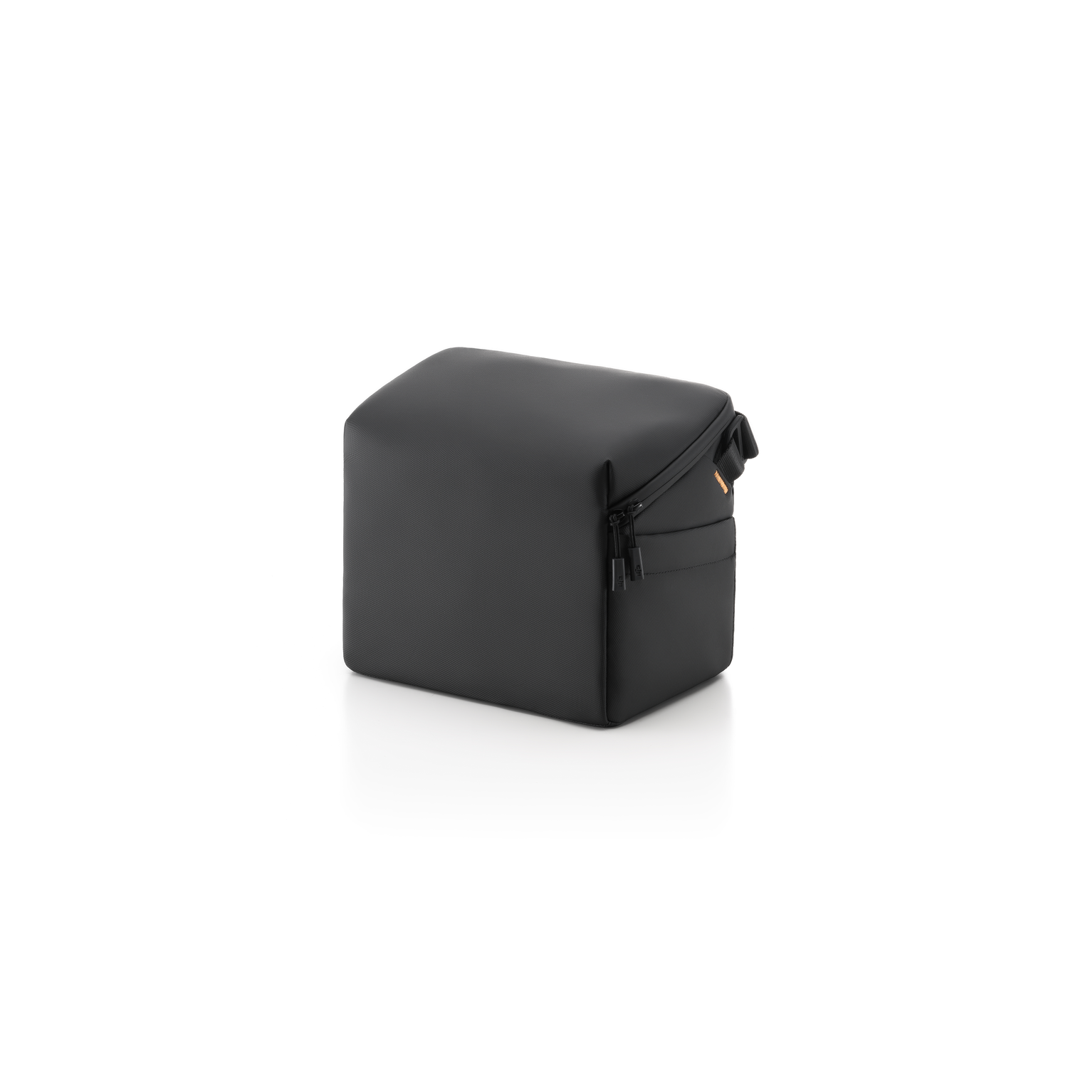 A small, black, cube-shaped carrying case on a white surface.