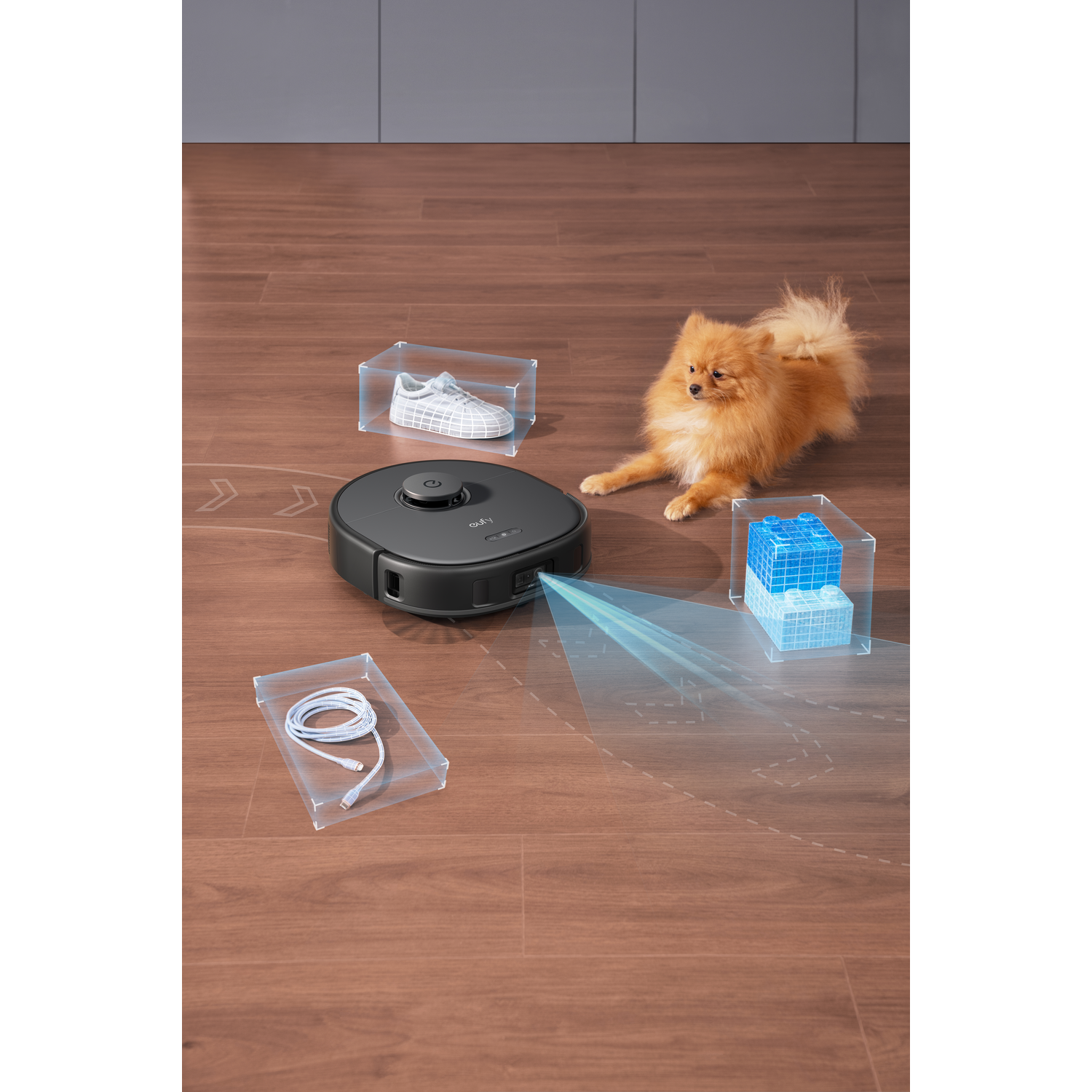 Robotstofzuiger met een hond en omlijnde objecten op een houten vloer.