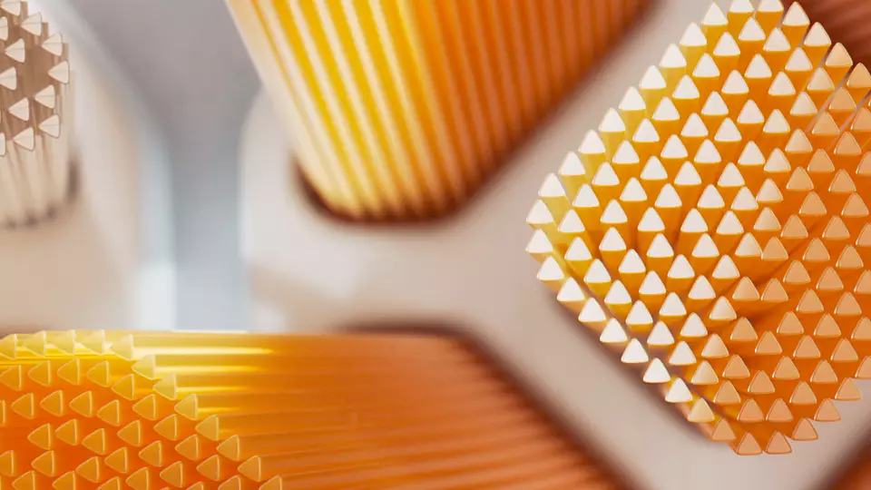 Primo piano di uno spazzolino da denti con setole arancioni.