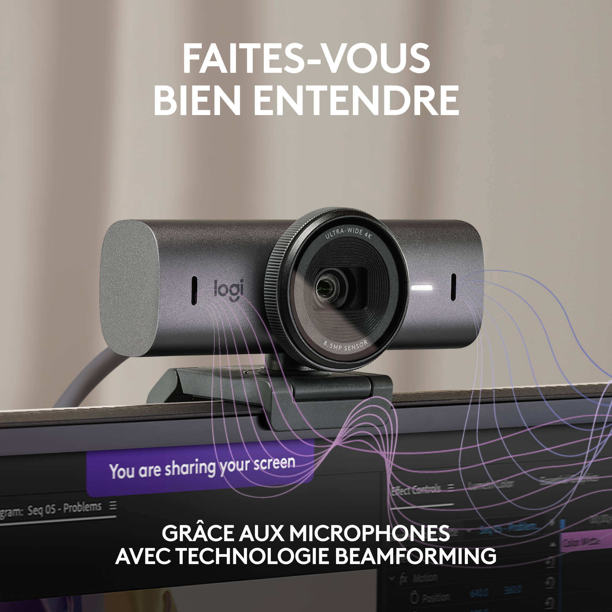 Webcam avec un corps noir, positionnée sur un écran, avec du texte en français au-dessus et en dessous.