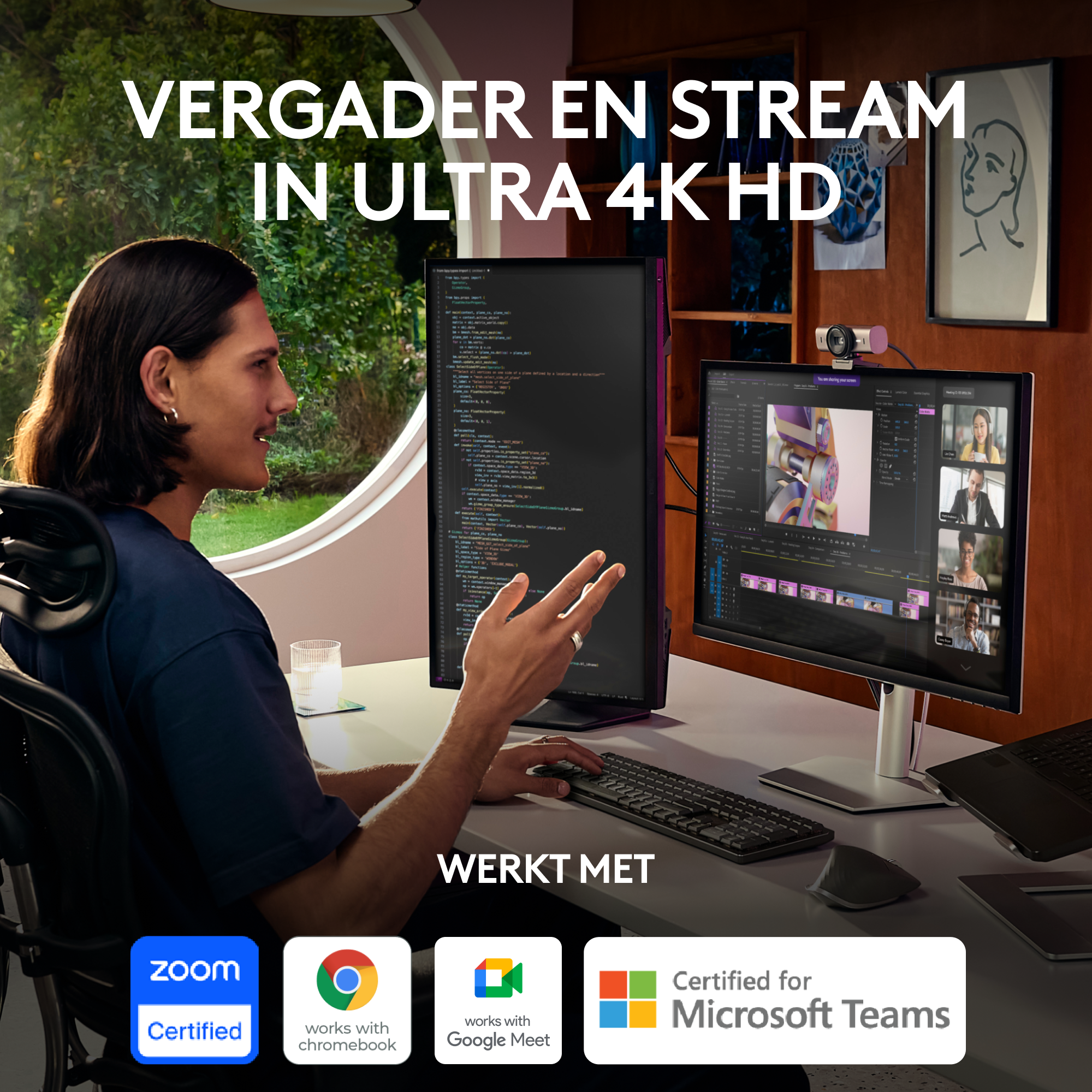 A person is sitting at a desk with two monitors and a keyboard, video conferencing. Zoom certified.