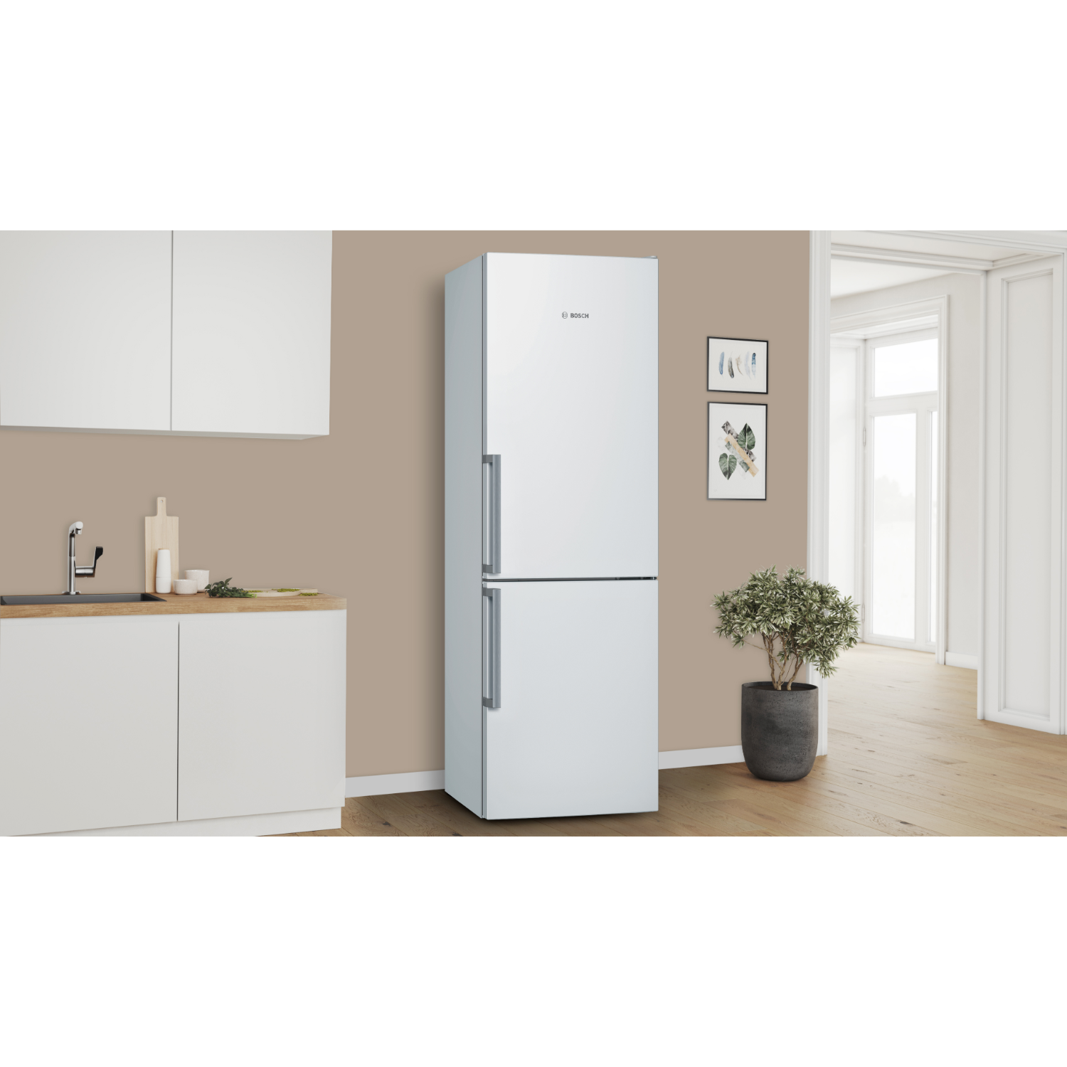 White refrigerator with two doors, in a room setting with art.