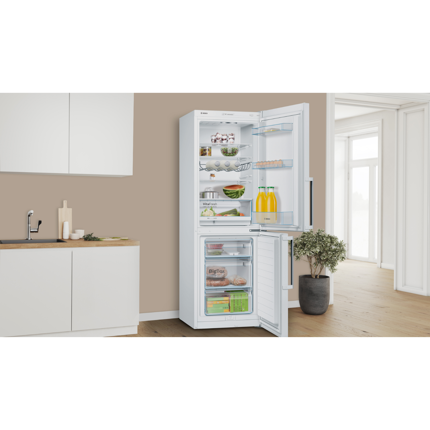 A white Bosch refrigerator with the door open, revealing items inside.