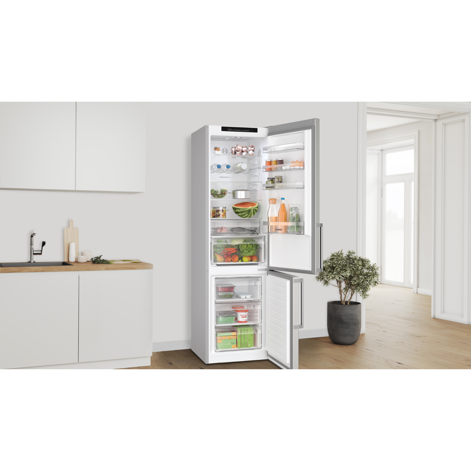 Open white refrigerator with food inside. It shows shelves and drawers with various items.