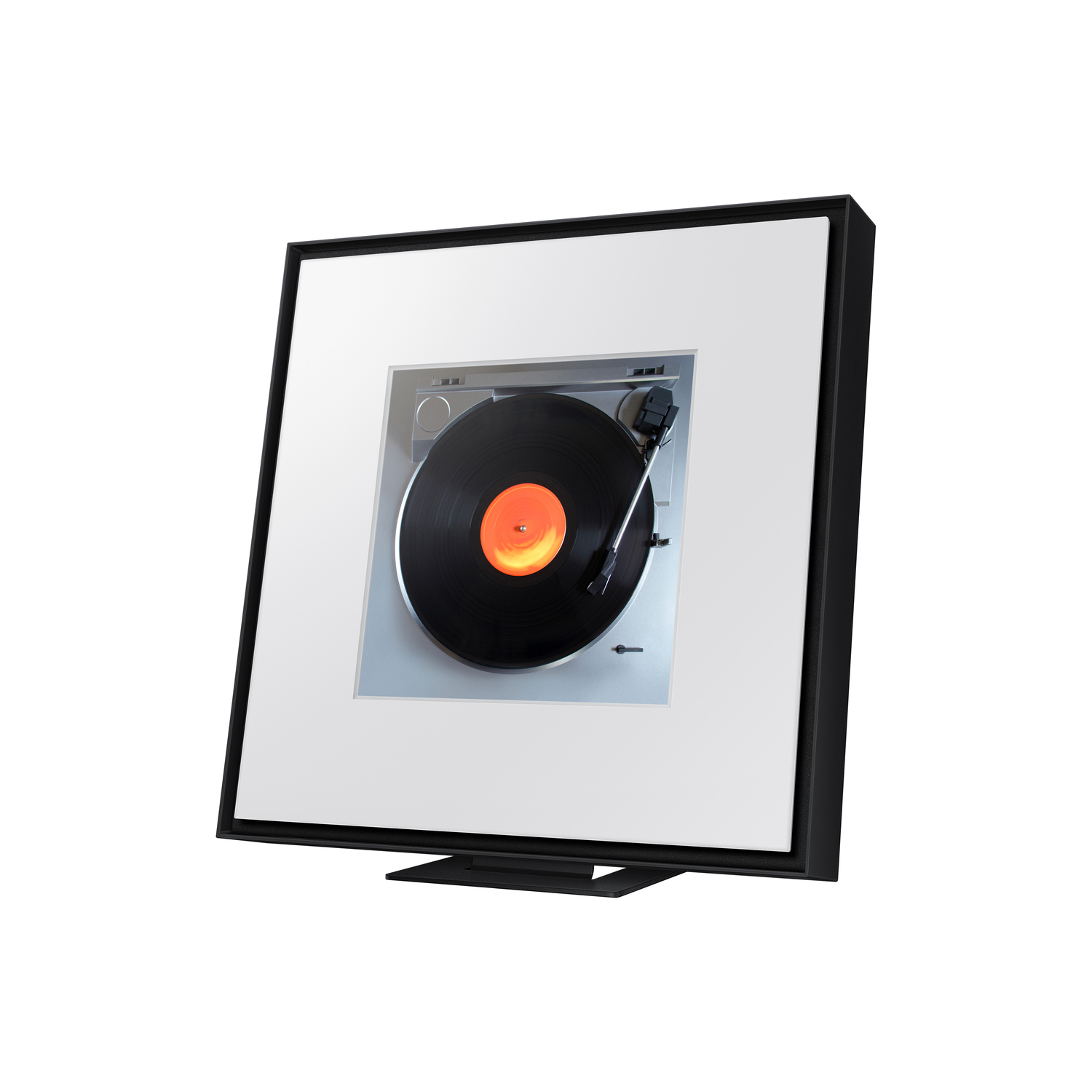 Platine vinyle à l'intérieur d'un cadre. Disque noir sur une surface blanche avec un cadre noir.