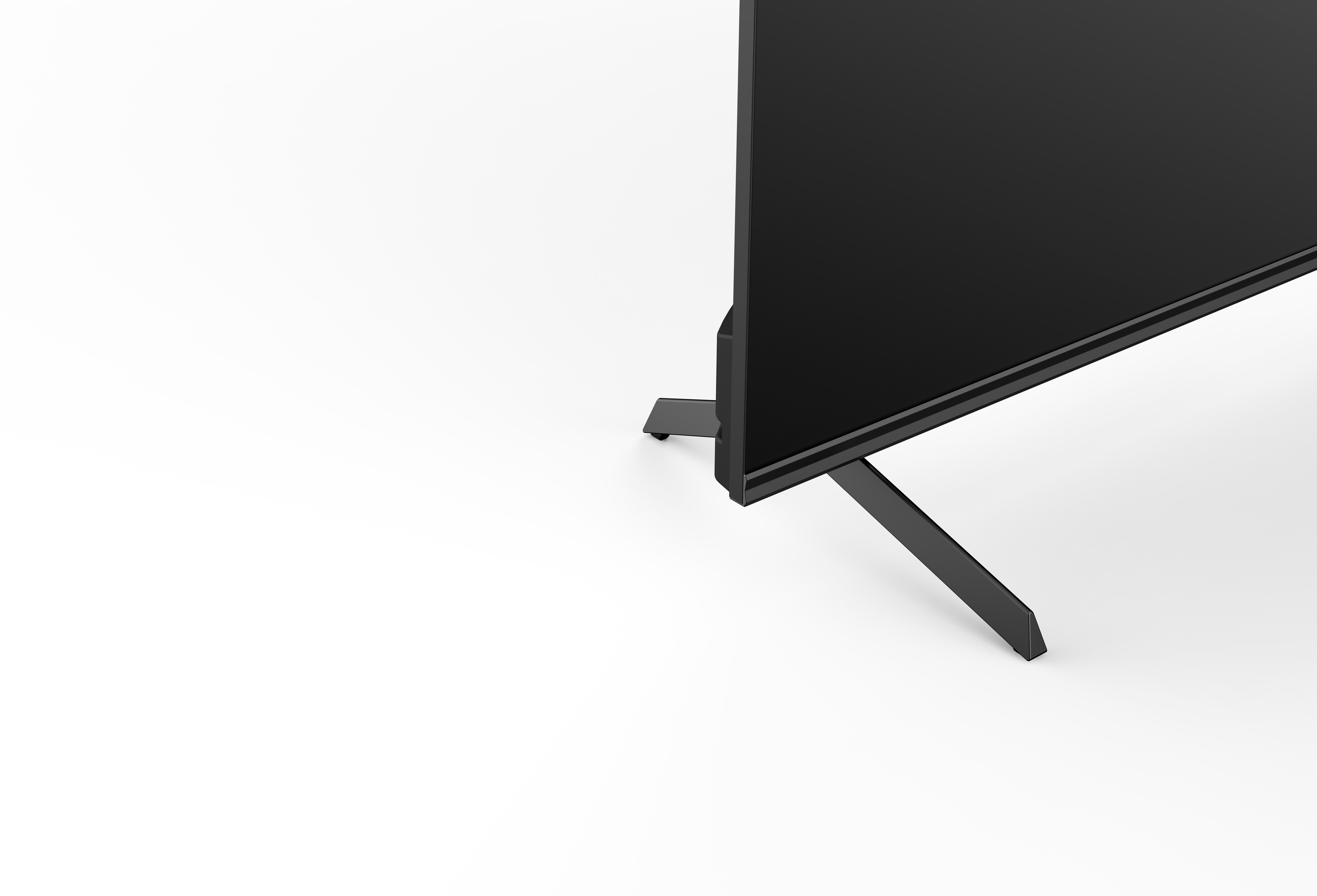 Ein schwarzer Fernseher mit Ständer auf weißem Hintergrund.