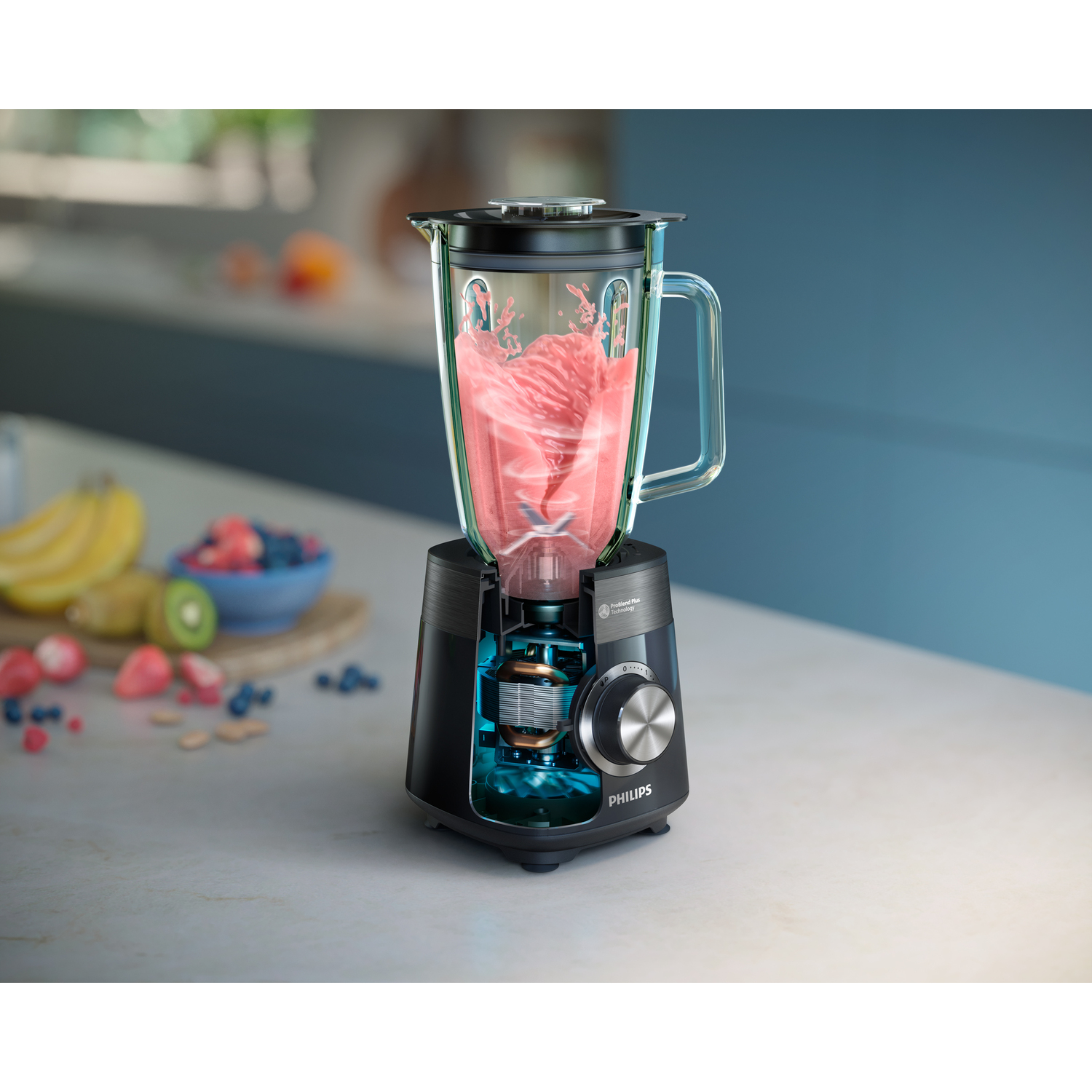 A blender with pink smoothie inside, showing internal components.