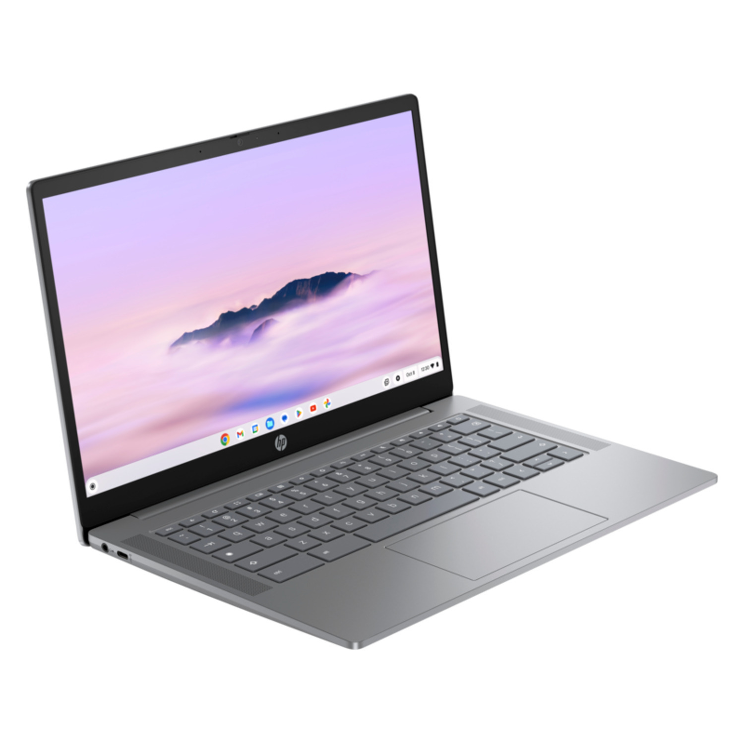 Silver laptop open, showing a screen with a cloudy background and a keyboard.